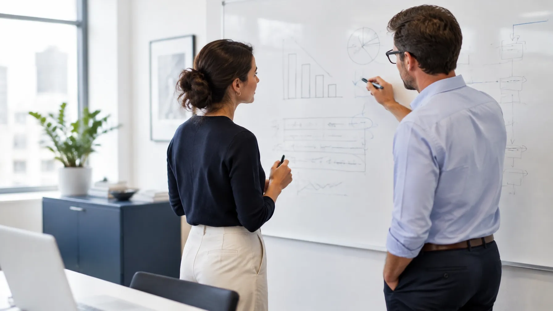 Colleagues reviewing software licence assignments together